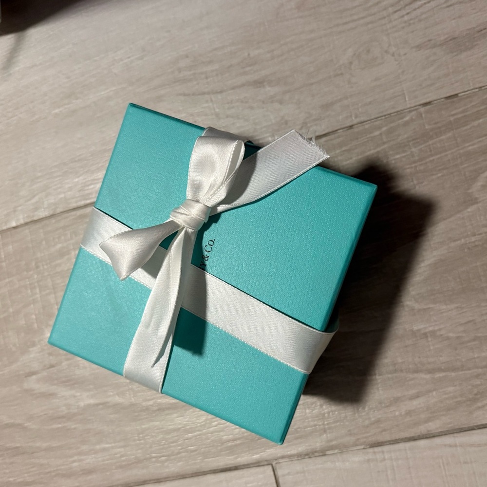 Tiffany & Co. robin's-egg blue jewelry box with white ribbon